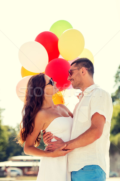 smiling couple in city Stock photo © dolgachov