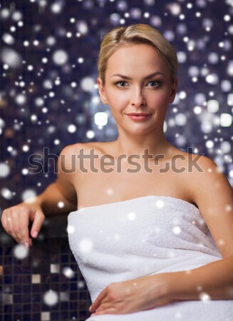 happy woman sitting in jacuzzi at poolside Stock photo © dolgachov