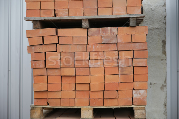 brown bricks batch on wooden storage tray Stock photo © dolgachov