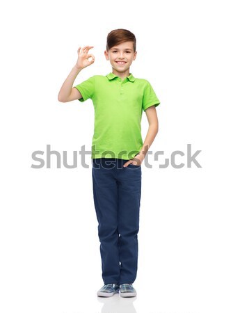 Vidám fiú fehér póló mutat ok kézjel Stock fotó © dolgachov