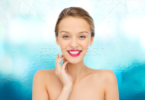 smiling young woman with pink lipstick on lips Stock photo © dolgachov