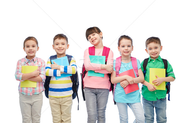 happy children with school bags and notebooks Stock photo © dolgachov