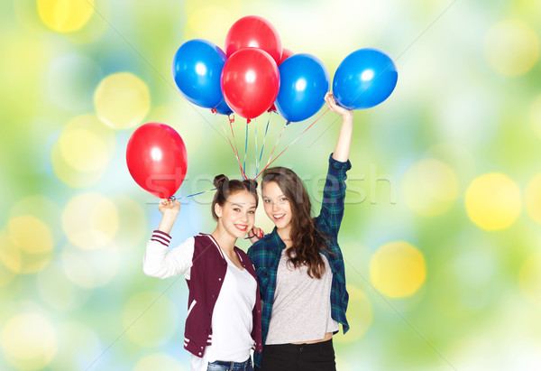 happy teenage girls with helium balloons Stock photo © dolgachov