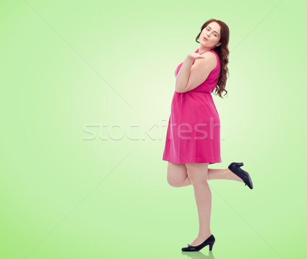 Feliz jovem plus size mulher soprar Foto stock © dolgachov