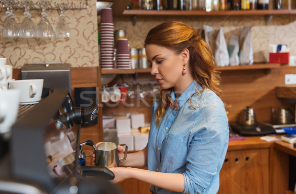 barista woman making coffee by machine at cafe Stock photo © dolgachov