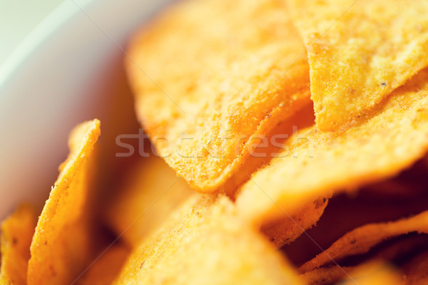 close up of corn crisps or nachos in bowl Stock photo © dolgachov