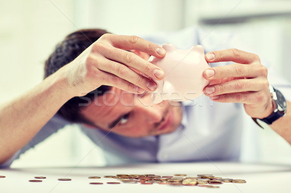 Om de afaceri pusculita monede birou oameni de afaceri Imagine de stoc © dolgachov