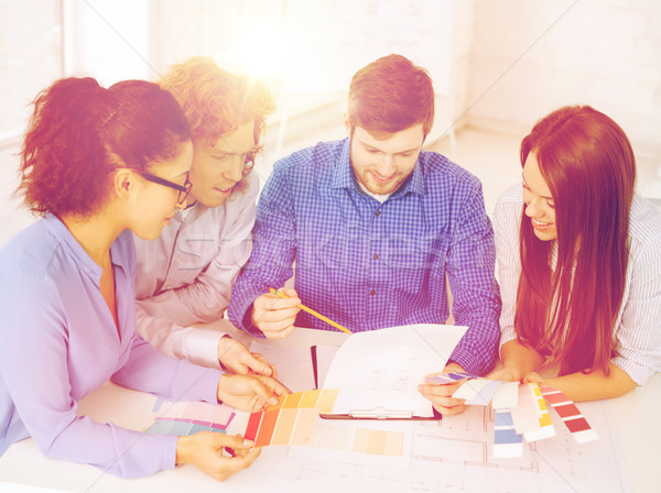 team with color samples and blueprint at office Stock photo © dolgachov