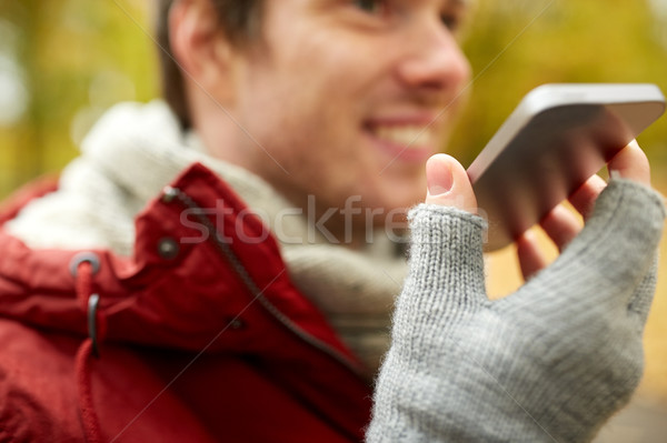 close up of man recording voice on smartphone Stock photo © dolgachov