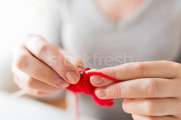 close up of hands knitting with needles and yarn Stock photo © dolgachov