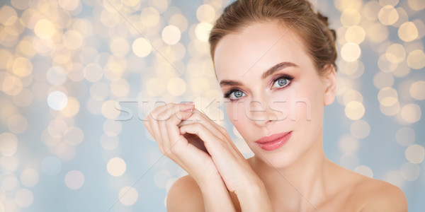 Stock photo: beautiful young woman face and hands