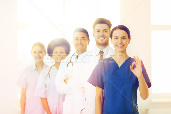 group of happy doctors at hospital Stock photo © dolgachov