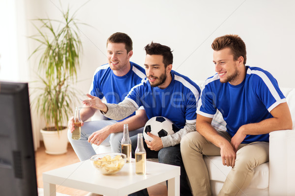 Stock photo: friends or football fans watching soccer at home