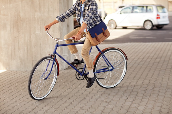 Jeunes homme sac équitation fixé [[stock_photo]] © dolgachov