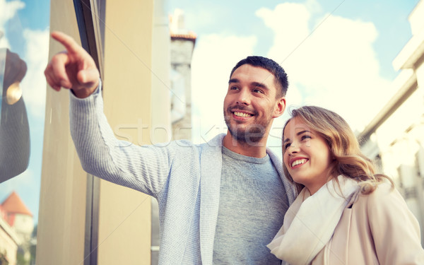 happy couple shopping and looking at shop window Stock photo © dolgachov