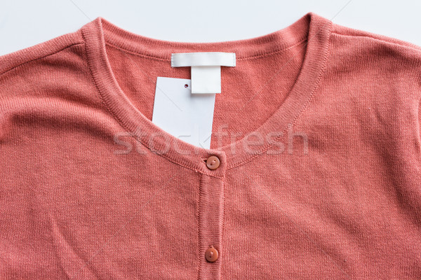Sweter rozpinany cena tag odzież nosić Zdjęcia stock © dolgachov