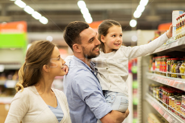 happy family buying food at grocery store Stock photo © dolgachov