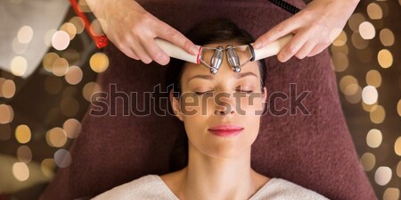 woman having hydradermie facial treatment in spa Stock photo © dolgachov