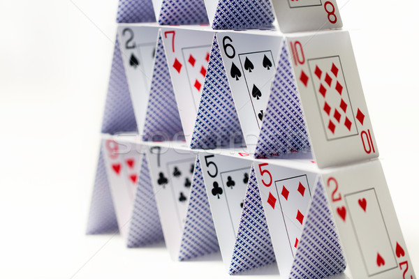 house of playing cards over white background Stock photo © dolgachov
