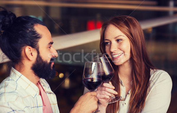 couple drinking red wine and clinking glasses Stock photo © dolgachov