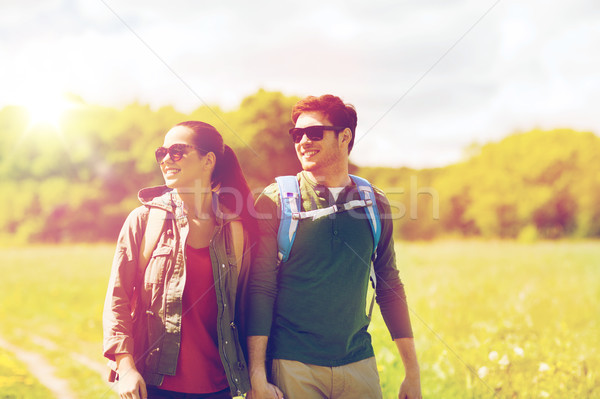 happy couple with backpacks hiking outdoors Stock photo © dolgachov