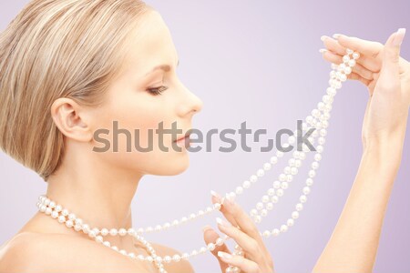 Gyönyörű nő gyöngy gyöngyök kép nő arc Stock fotó © dolgachov
