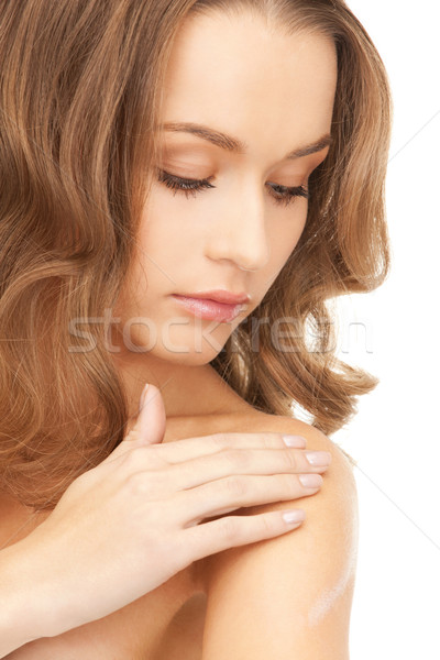beautiful woman with moisturizing creme Stock photo © dolgachov