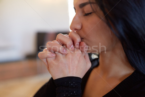 close up of unhappy woman praying god at funeral Stock photo © dolgachov