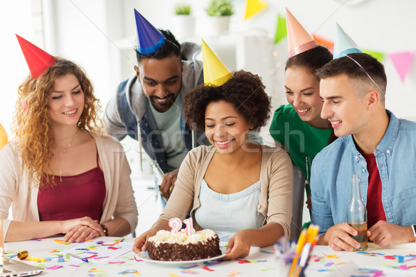 team greeting colleague at office birthday party Stock photo © dolgachov