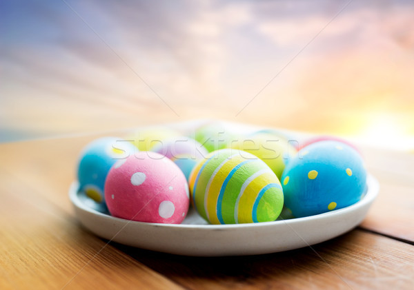 close up of colored easter eggs on plate Stock photo © dolgachov