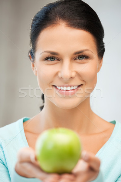 lovely housewife with green apple Stock photo © dolgachov