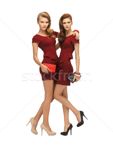 Dois vermelho vestidos quadro mulher Foto stock © dolgachov