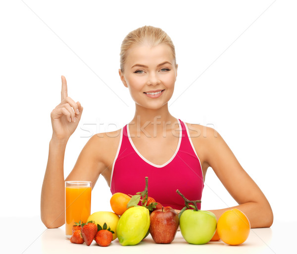Nő dzsúz gyümölcsök tart ujj felfelé Stock fotó © dolgachov
