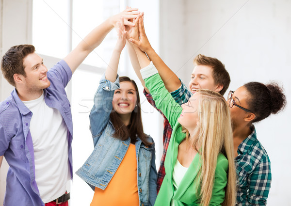 Zdjęcia stock: Szczęśliwy · studentów · high · five · szkoły · edukacji · przyjaźni