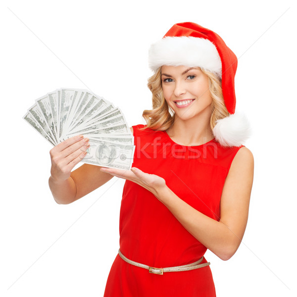 woman in santa helper hat with us dollar money Stock photo © dolgachov