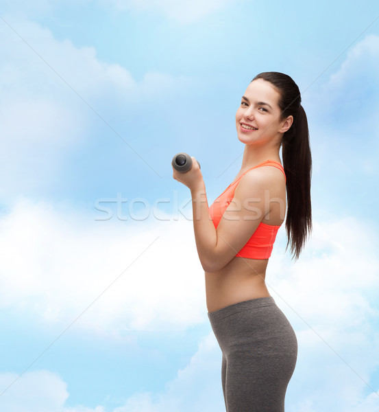 young sporty woman with light dumbbells Stock photo © dolgachov