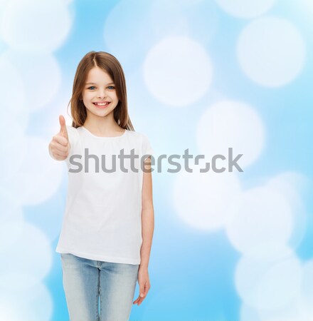 Souriant petite fille blanche tshirt publicité design [[stock_photo]] © dolgachov