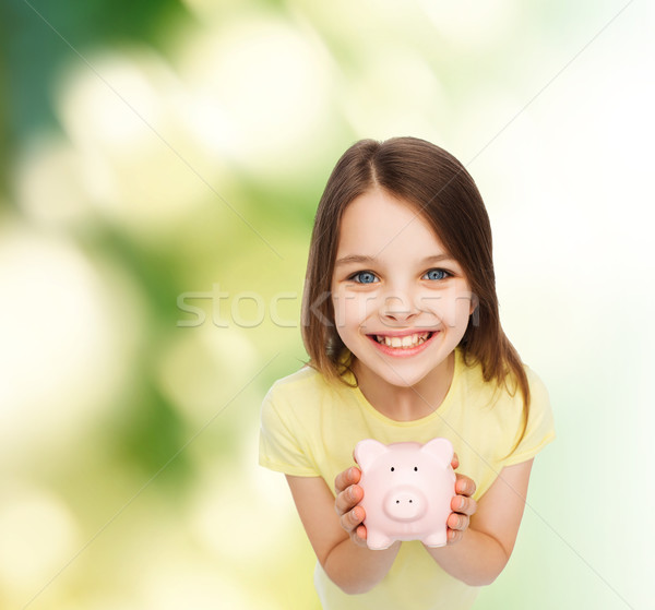 Beautiful Little Girl With Piggy Bank Stock Photo C Syda