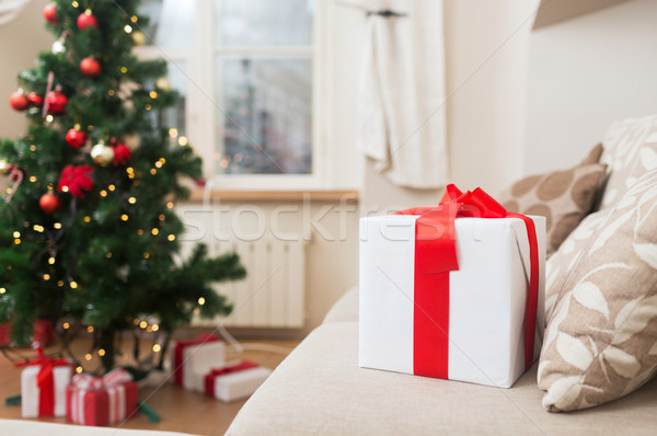 gift box on coach at home Stock photo © dolgachov