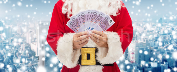 close up of santa claus with euro money Stock photo © dolgachov