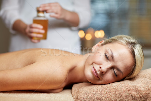 close up of woman lying on massage table in spa Stock photo © dolgachov