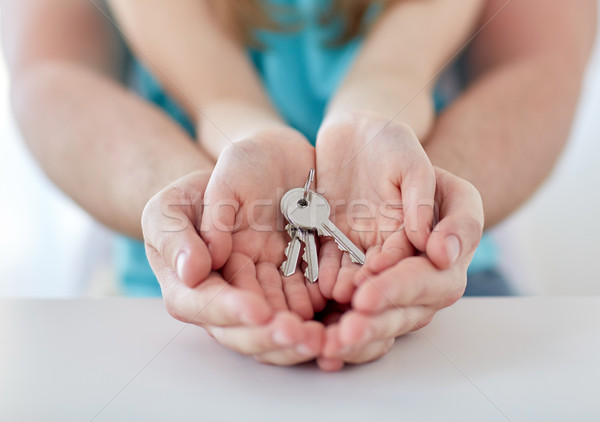 close up of man and girl hands with house keys Stock photo © dolgachov