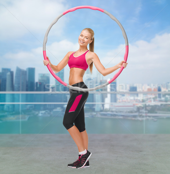 young sporty woman with hula hoop Stock photo © dolgachov