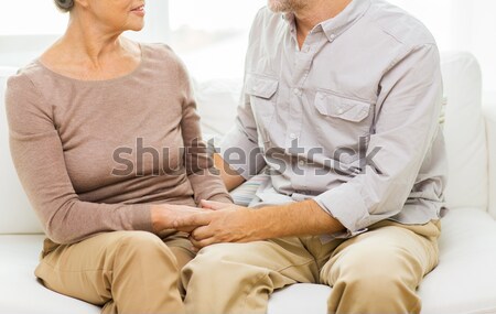 Stock photo: close up of happy male gay couple holding hands
