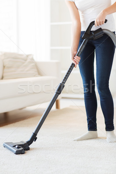 close up of woman with vacuum cleaner at home Stock photo © dolgachov