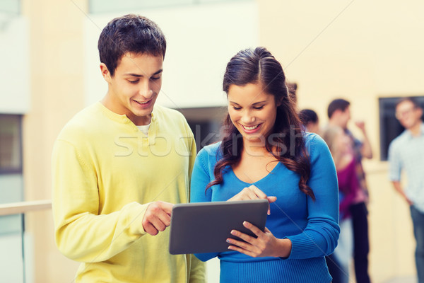 group of smiling students tablet pc computer Stock photo © dolgachov