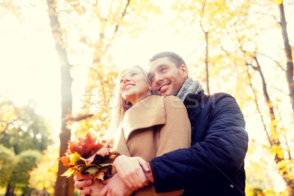 smiling couple hugging in autumn park Stock photo © dolgachov