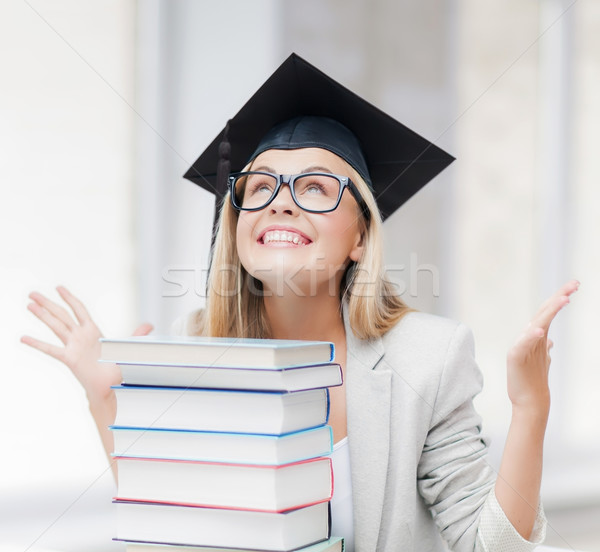 happy student in graduation cap Stock photo © dolgachov