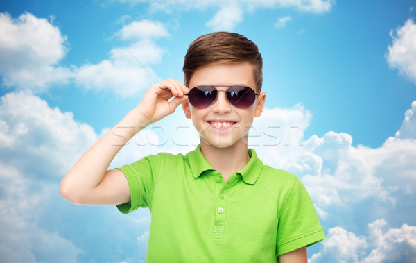 smiling boy in sunglasses and green polo t-shirt Stock photo © dolgachov