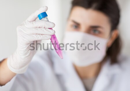 close up of scientist with tube making test in lab Stock photo © dolgachov